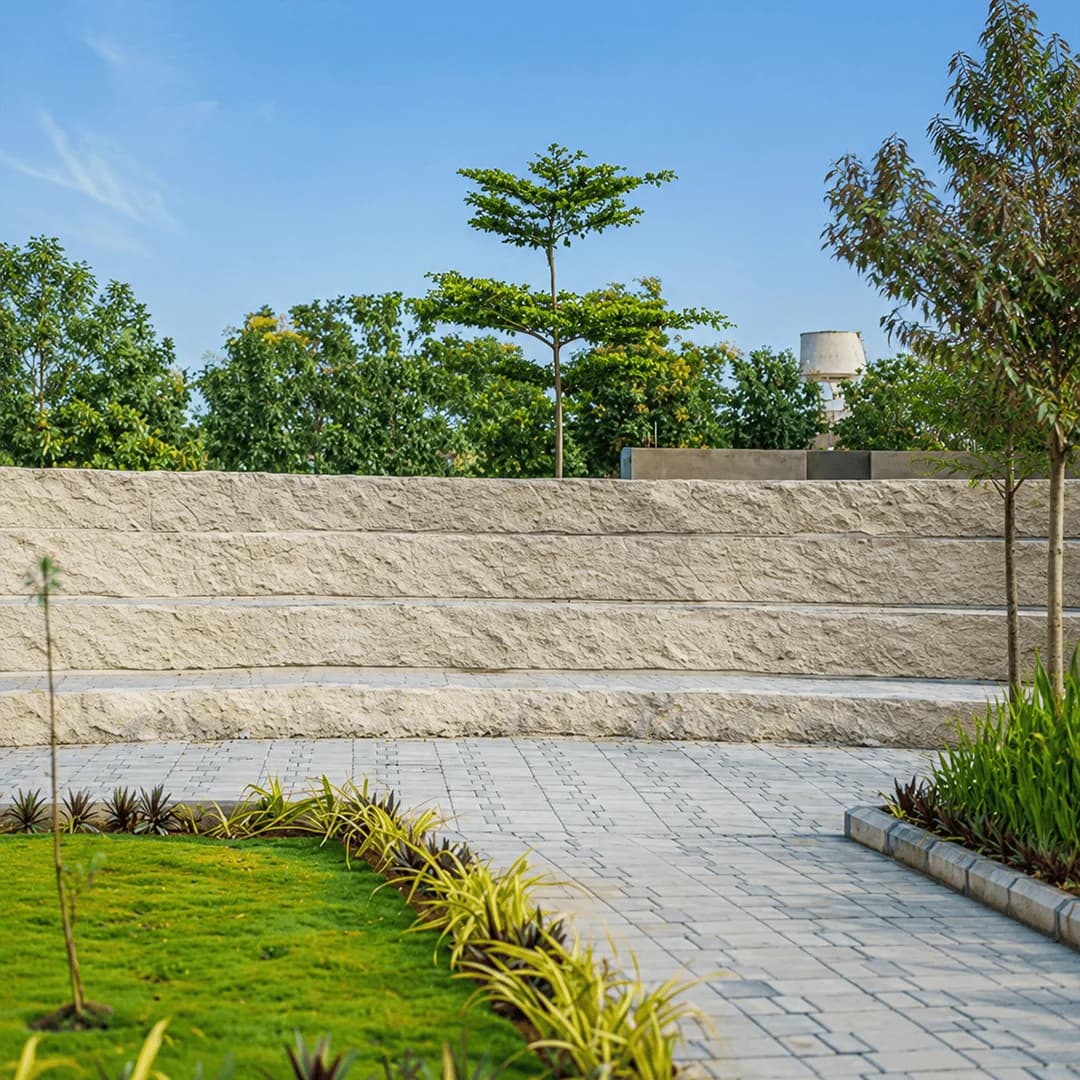 Stone amphitheatre seating in the landscaped central park of the Brickland Platinum gated community