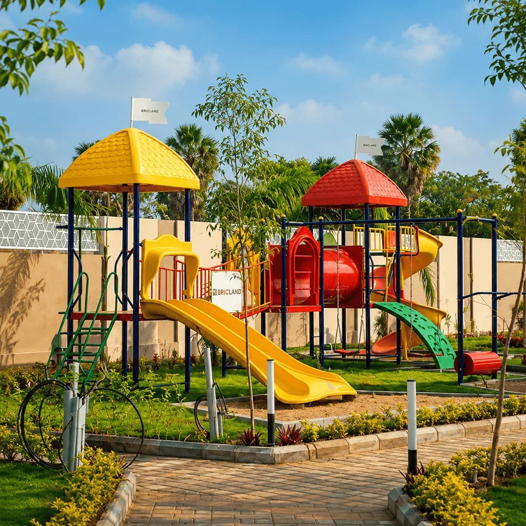 Colourful slides and climbing equipment in the children's play area at the Brickland Platinum gated community